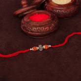 Silver Round Oxidized Bali Beads With Dual Rudraksha Rakhi